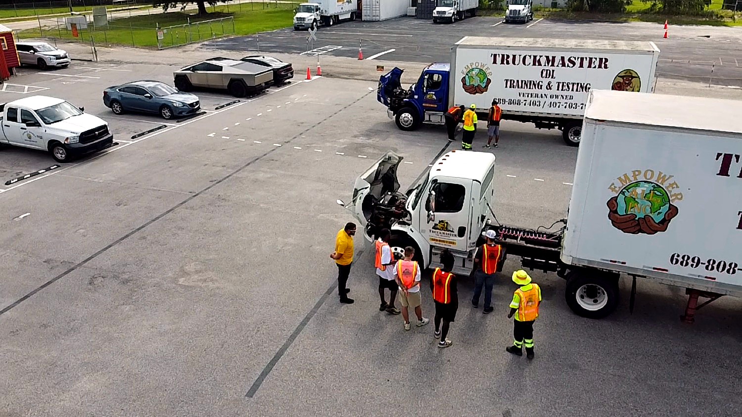 Byron Simpson teaching a group of CDL students a pre-trip inspection at the TruckMaster training yard in Apopka, FL